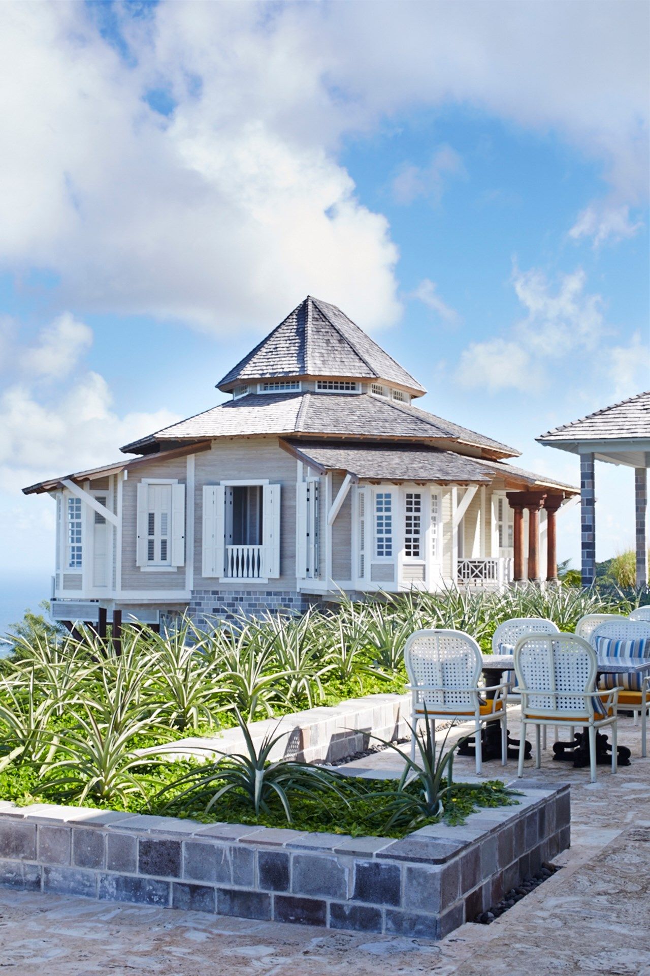 Image may contain Furniture Chair Building Plant and Patio