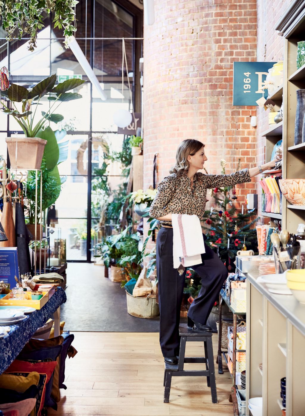 Image may contain Human Person Clothing Apparel Shop Interior Design Indoors and Shelf
