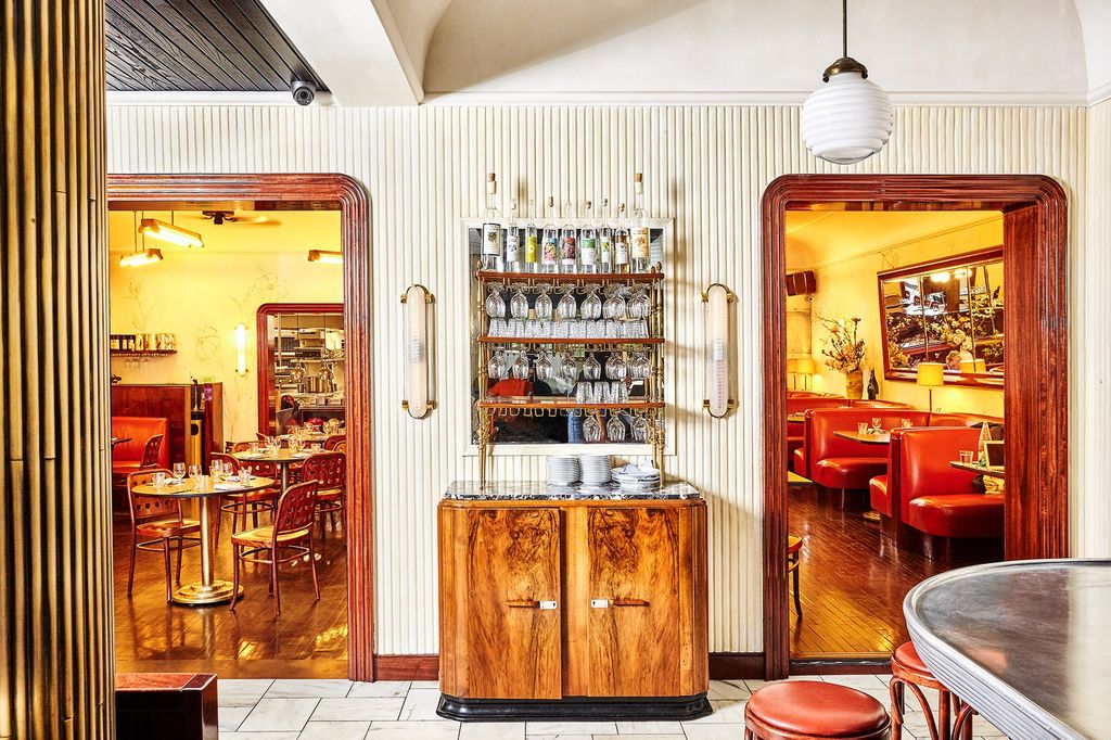 Image may contain Furniture Chair Restaurant Cafe Interior Design Indoors and Shelf