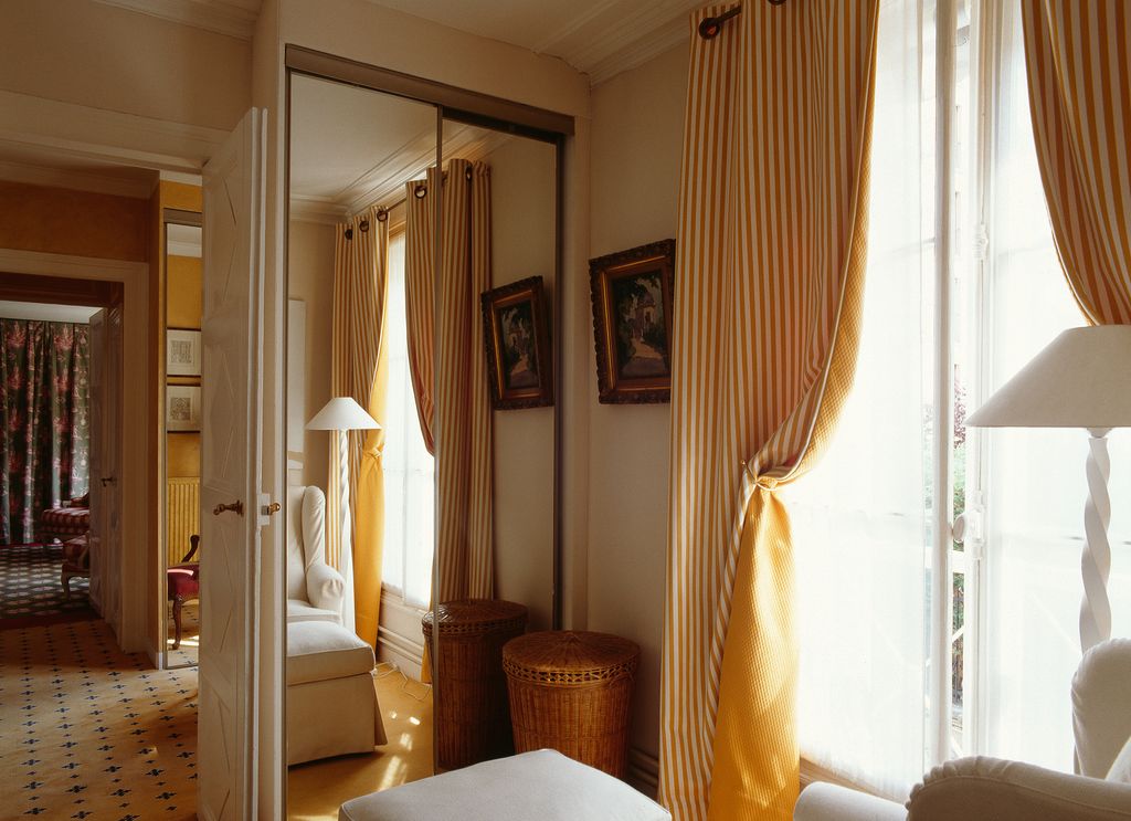 Image may contain Home Decor Furniture Living Room Room Indoors Wood Couch Flooring Interior Design and Bedroom