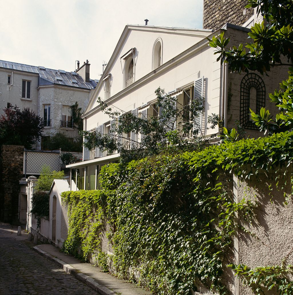 Image may contain Path Walkway Plant Flagstone Outdoors Garden and Arbour