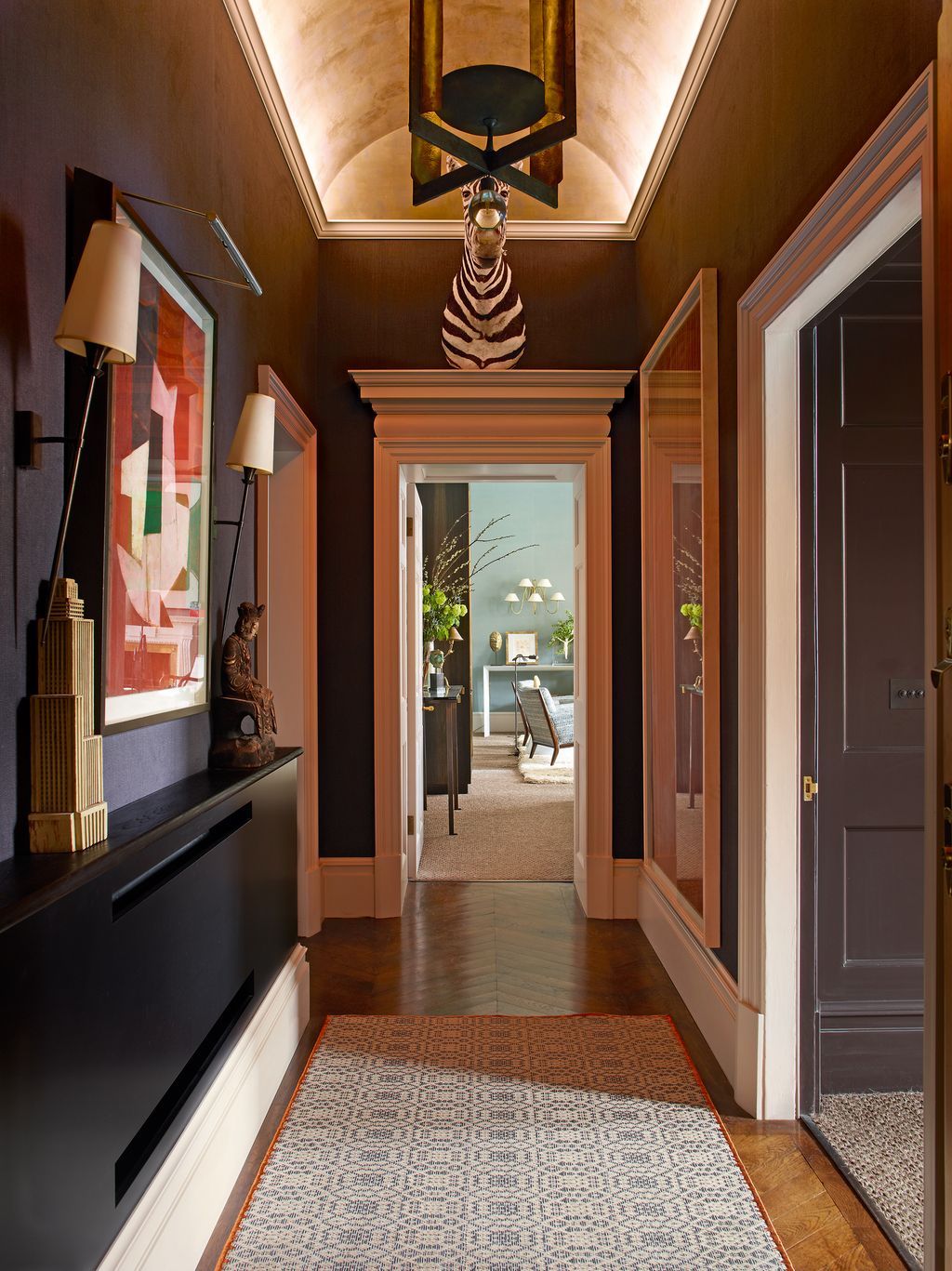 An abstract painting by Adrian Heath hangs in the hall.