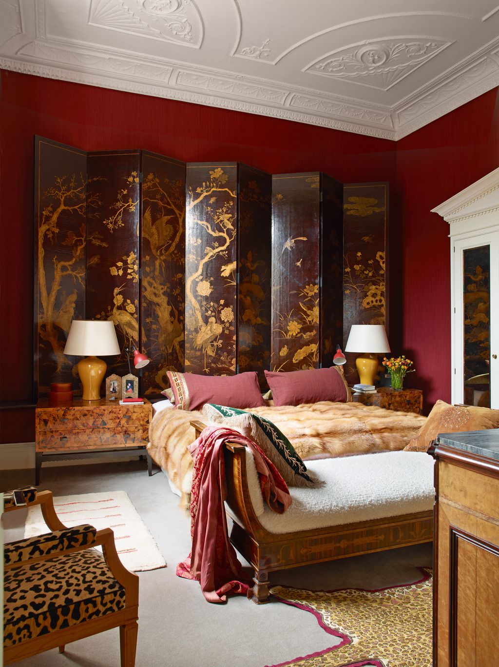 The magnificent Jansen screen in the bedroom is raised on a platform. To either side of the bed are penshell cabinets by...