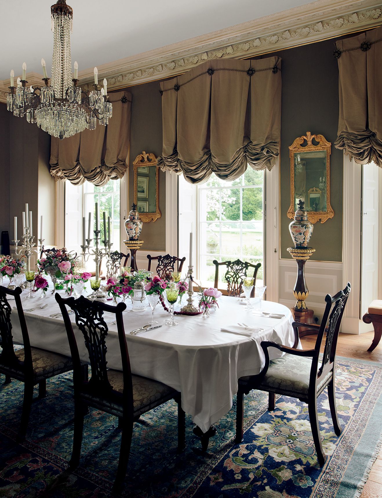 In this Regency house by Philip Hooper the walls were hung with a subtle velvet in a streamwater green. This says the...