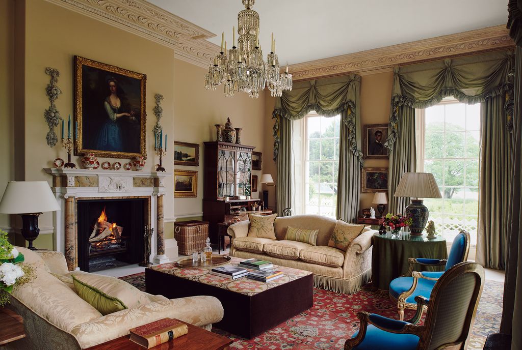 Image may contain Living Room Room Indoors Furniture Chair Interior Design Couch Lamp Chandelier Rug and Hearth