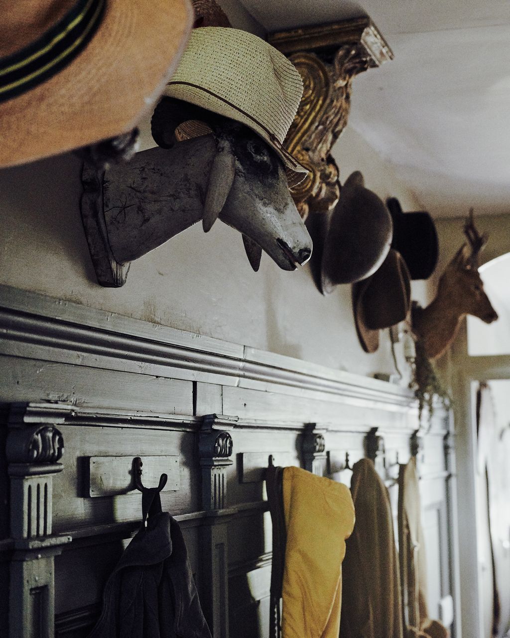 Image may contain Furniture Clothing Apparel Hat Human and Person