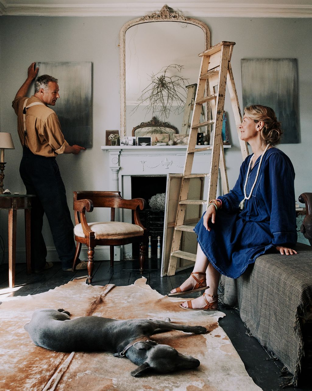 Image may contain Human Person Wood Animal Dog Mammal Pet Canine Plywood Flooring Living Room Room and Indoors