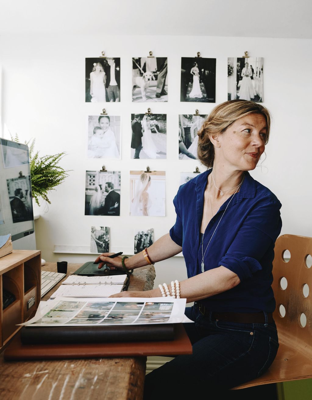 Bella putting together lookbooks for the couples photography business Wild Weddings.