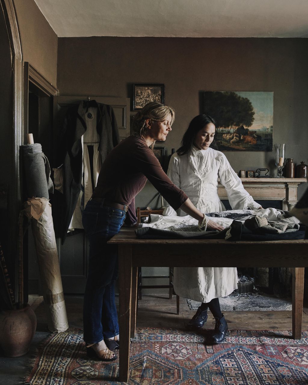 Image may contain Human Person Clothing Apparel Wood Sitting Plywood and Furniture