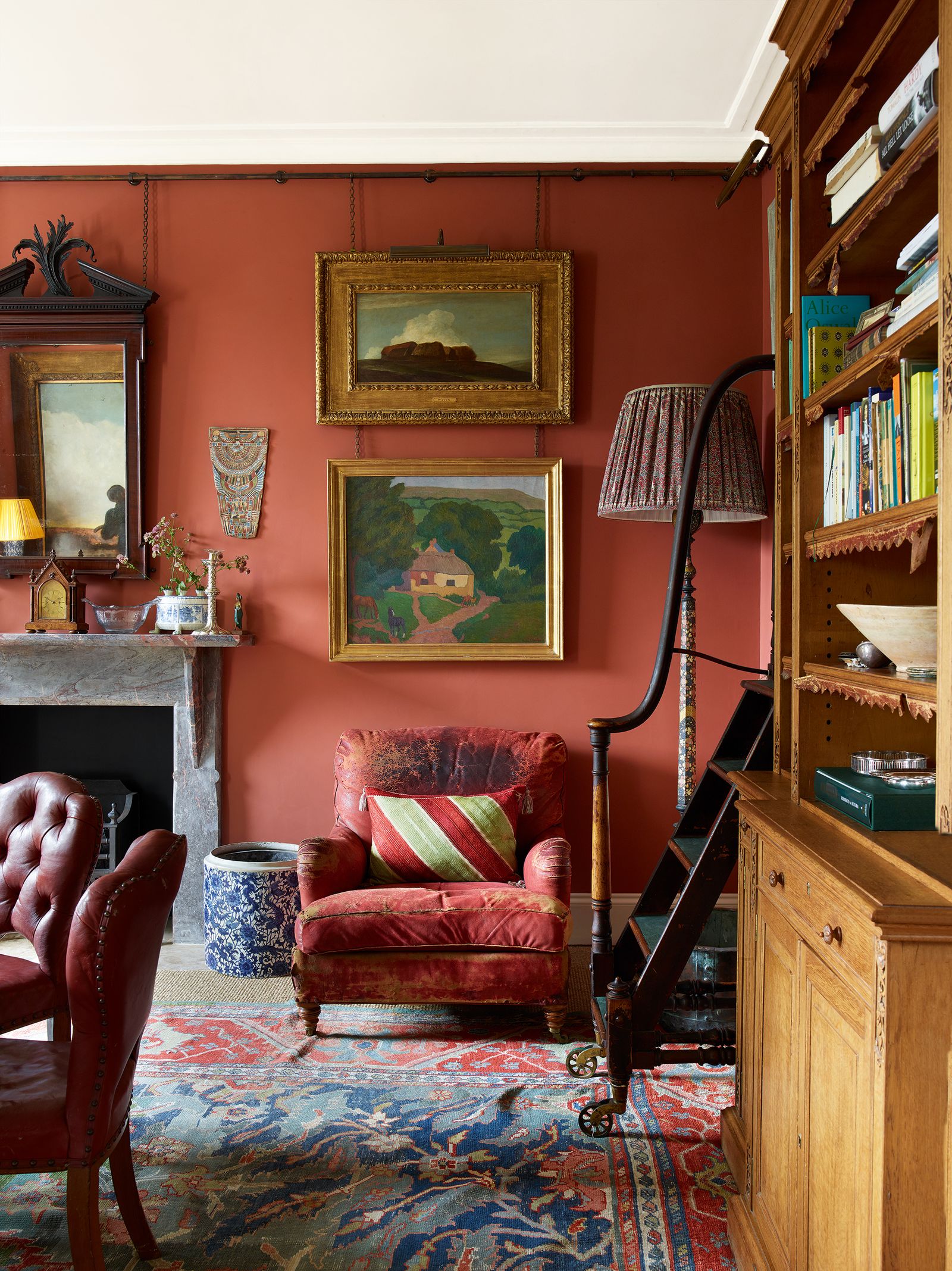 Image may contain Furniture Chair Living Room Room Indoors Interior Design Shelf Bookcase and Wood