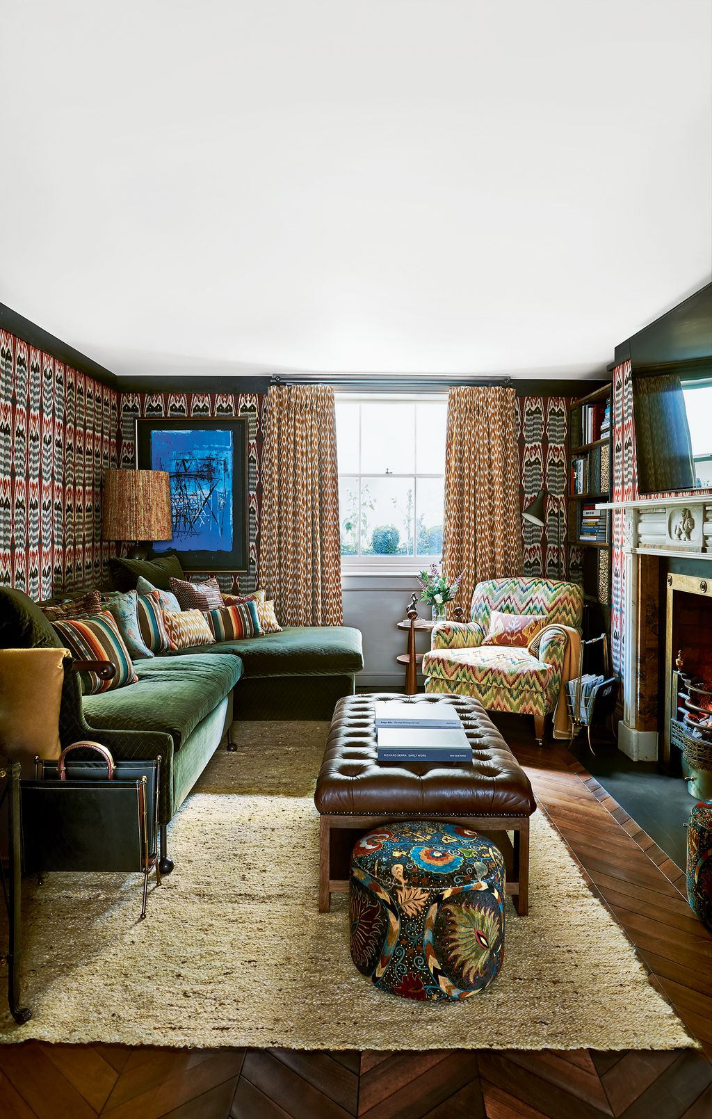 Image may contain Furniture Living Room Indoors Room Couch Rug Interior Design and Chair