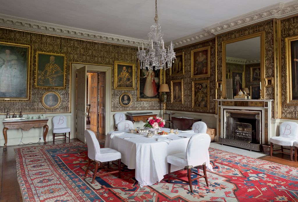 In the Family Dining Room the linen covers on the mahogany dining chairs are stencilled with a 'B' monogram.