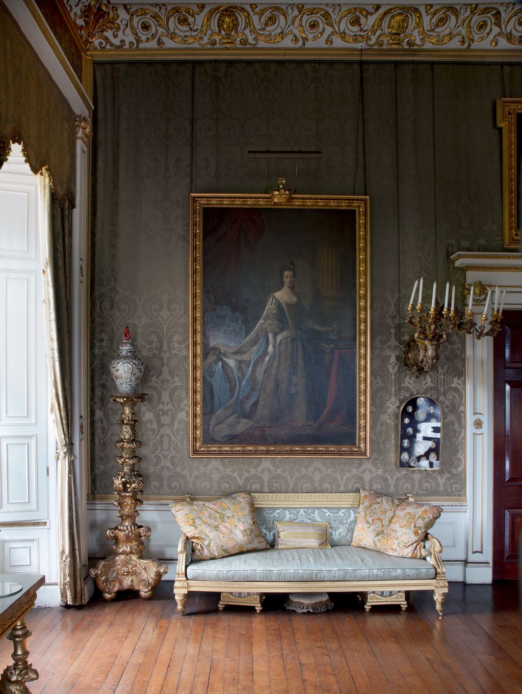 Image may contain Furniture Living Room Indoors Room Couch Interior Design Home Decor Table Cushion and Pillow