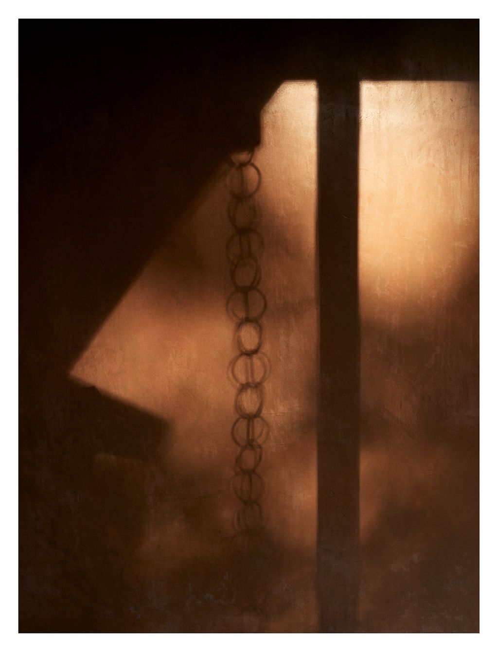 In the inner courtyards chains act as a gutter system to guide the rain from the roof to the ground here the links cast...