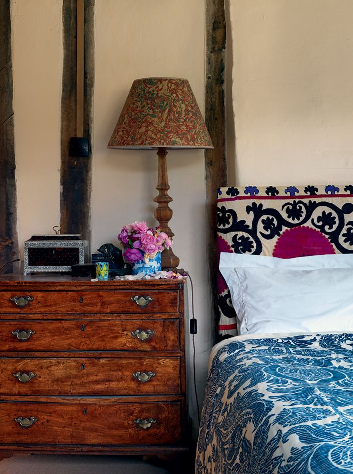 Beams line the wall in the main bedroom the fabric used for the bedcover is by Bennison.