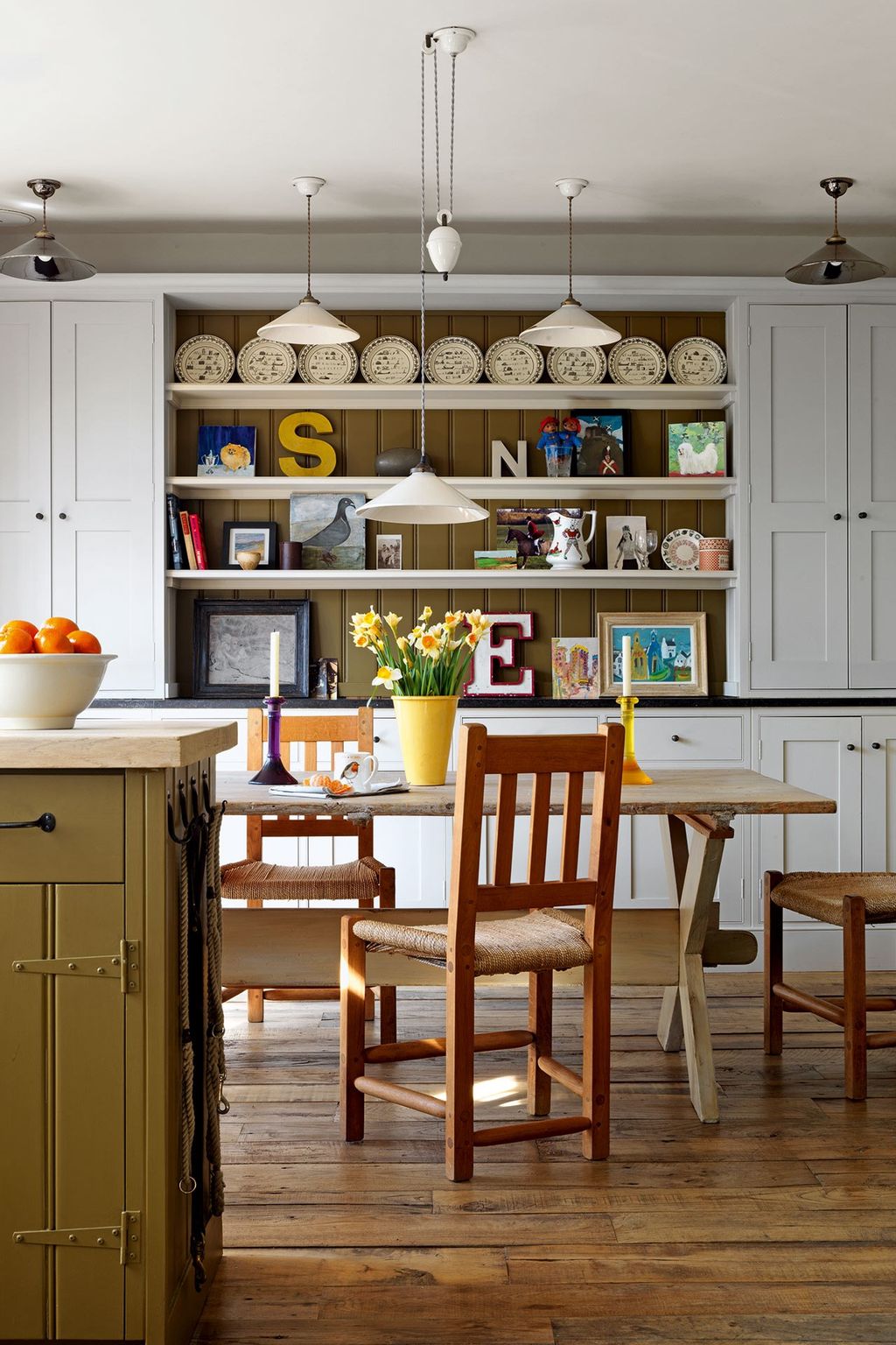 Image may contain Furniture Chair Indoors Shelf Room Dining Table Table and Wood