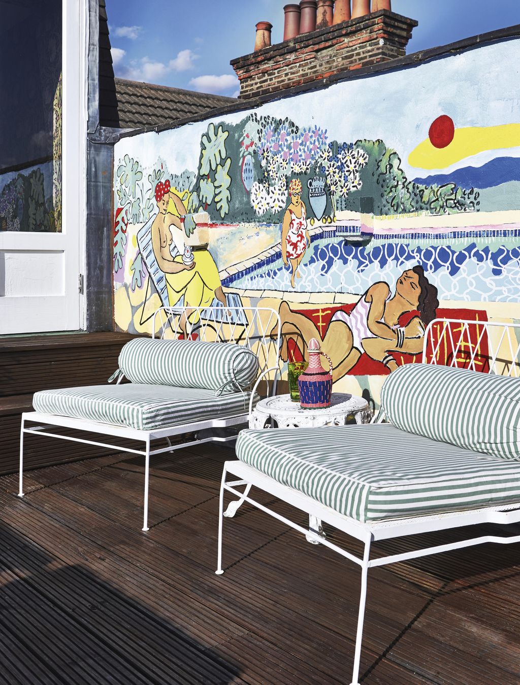 Image may contain Furniture Couch Cushion Pillow Porch Art Rug Mural Painting Interior Design and Indoors