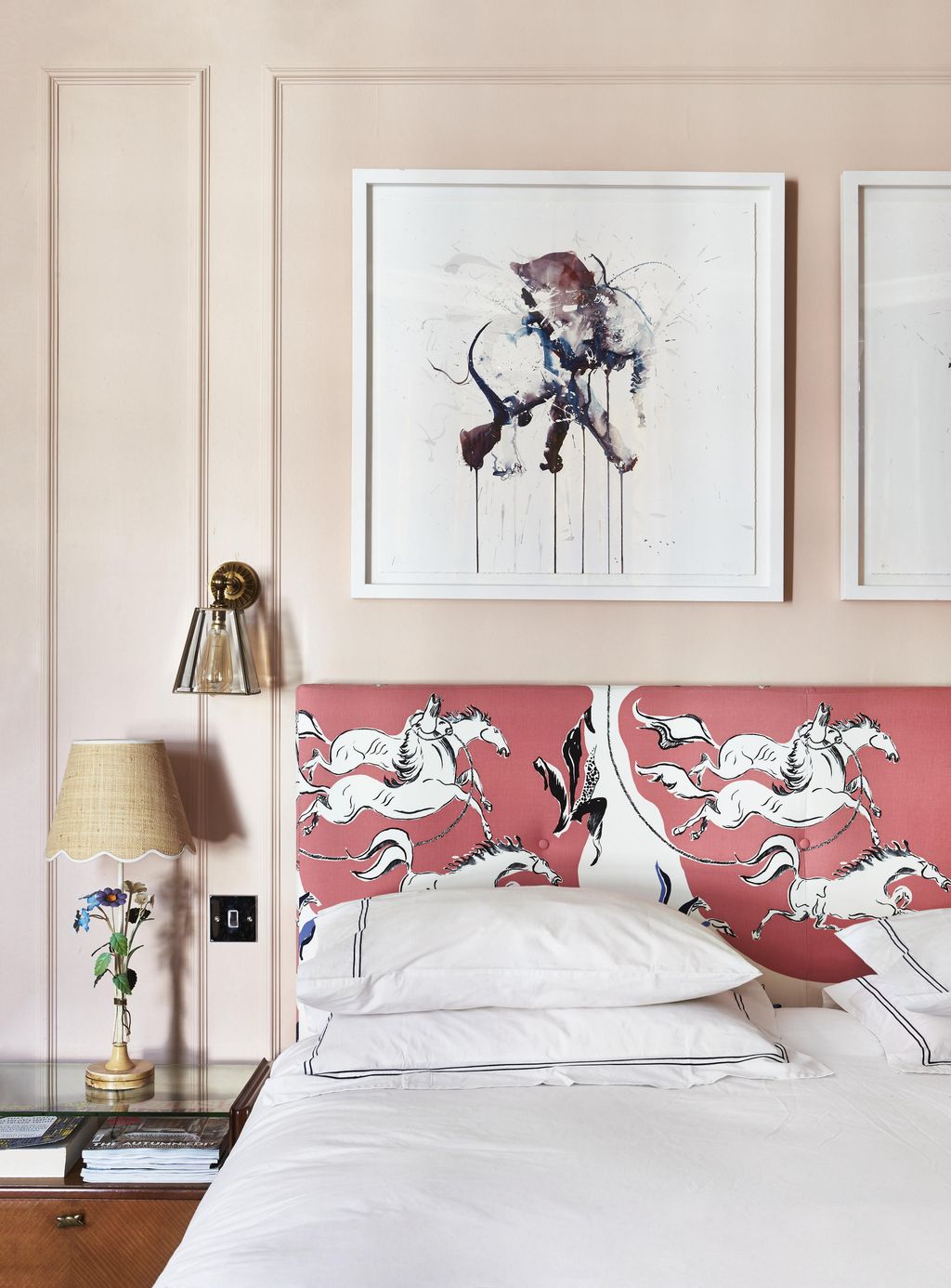 A vintage lamp is paired with a scalloped shade in the pretty bedroom of journalist Pandora Sykes.