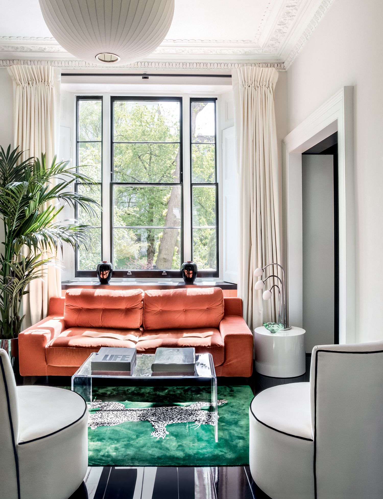 Image may contain Furniture Couch Table Living Room Indoors Room Coffee Table and Rug