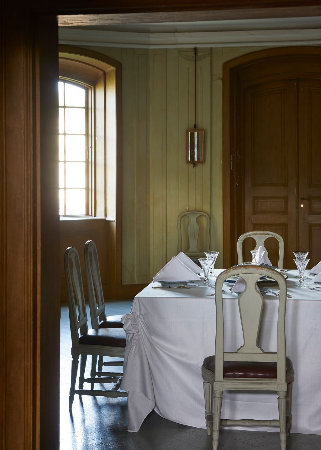 Image may contain Furniture Chair Table Dining Table Tablecloth Home Decor Indoors Room and Dining Room