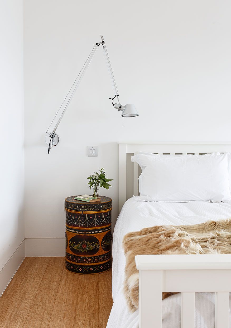 Image may contain Corner Room Bedroom Indoors Interior Design Plant Furniture and Bed