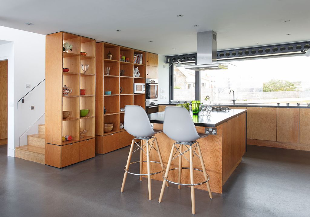 Image may contain Furniture Wood Chair Indoors Interior Design Shelf and Plywood