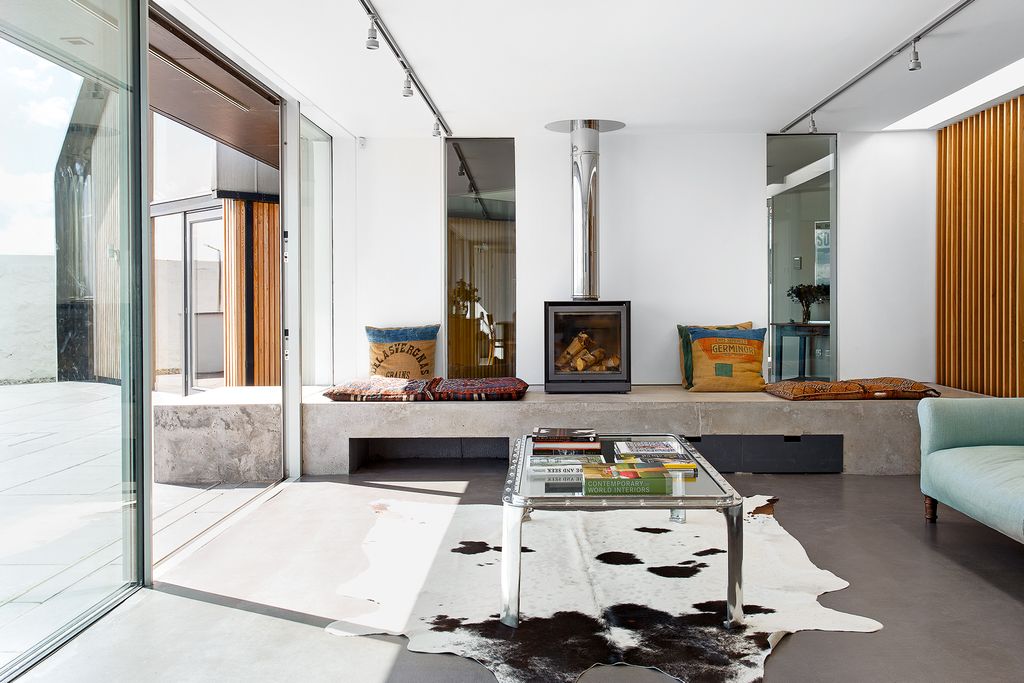 Image may contain Flooring Floor Indoors Living Room Room Furniture Rug Lobby Housing Building and Table