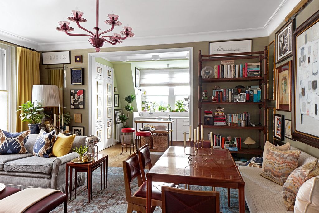 Image may contain Furniture Interior Design Indoors Living Room Room Chair Wood Bookcase Lamp and Chandelier