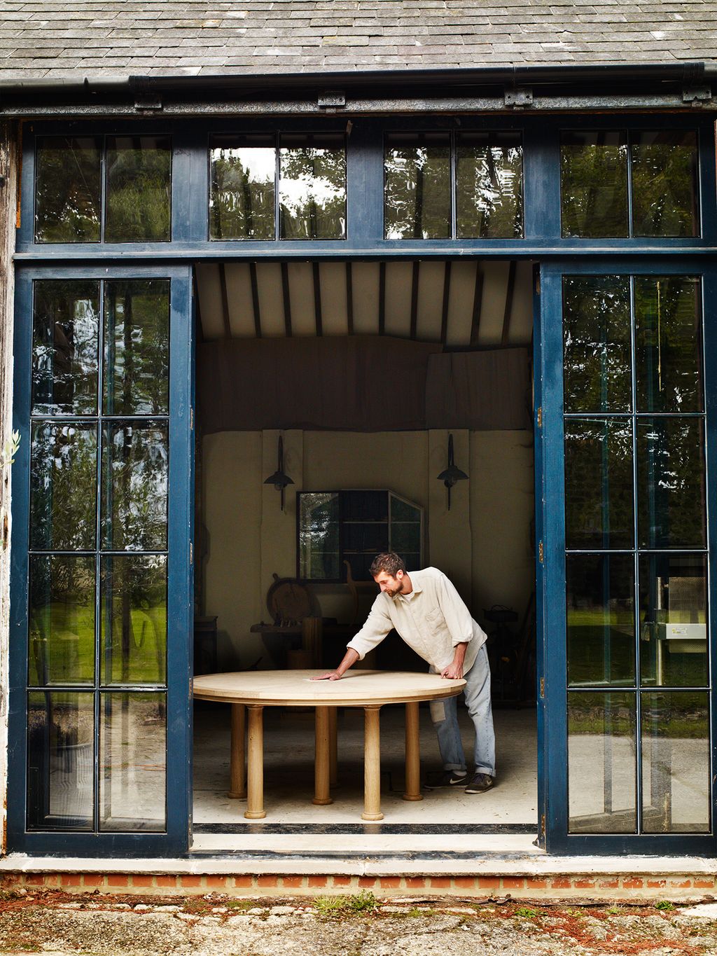 Image may contain Human Person Door Clothing Shoe Footwear Apparel and Folding Door