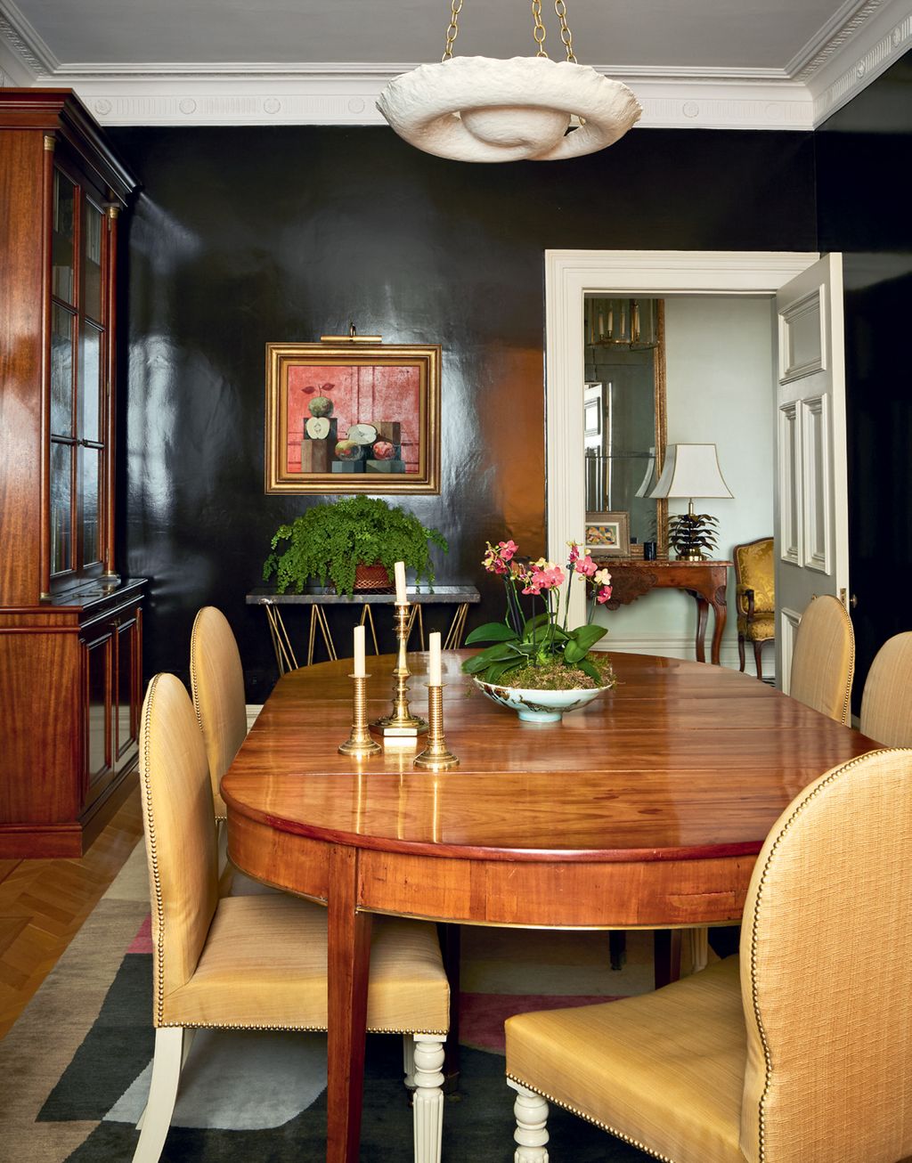 Image may contain Furniture Chair Room Indoors Dining Room Interior Design Flooring Hardwood Wood and Living Room