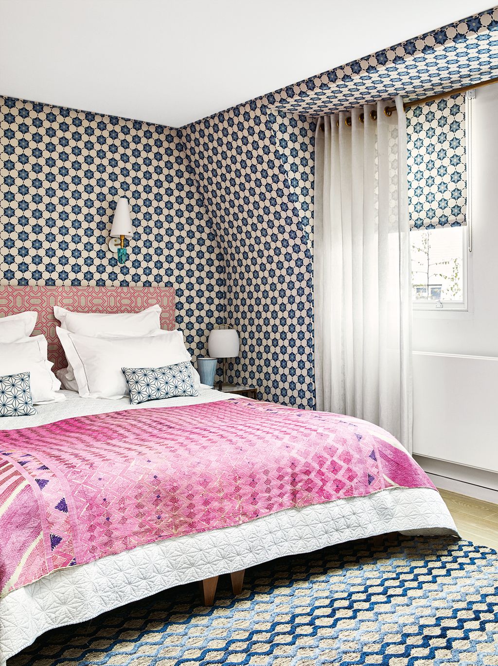 Image may contain Indoors Room Bedroom Furniture Bed Dorm Room and Rug