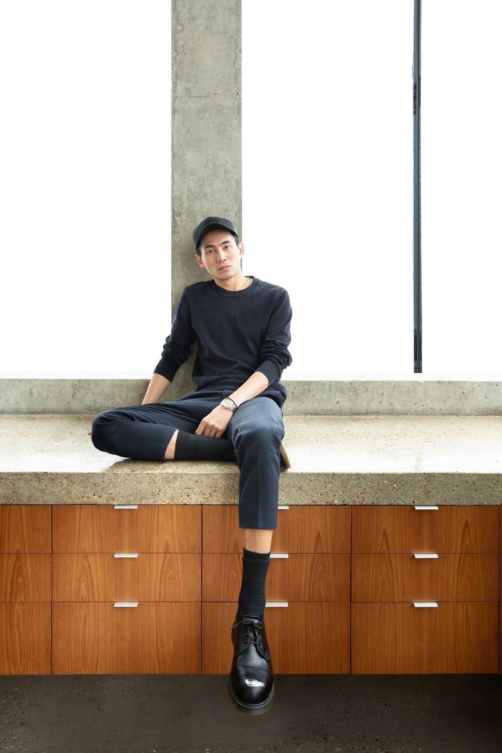 Image may contain Sitting Human Person Clothing Shoe Footwear and Apparel