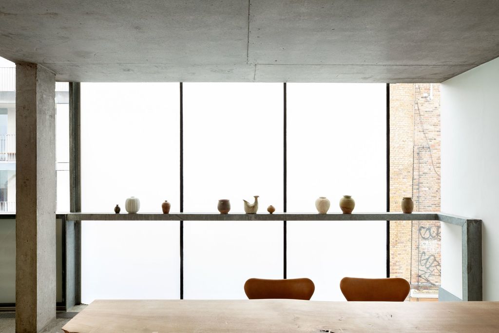 Image may contain Furniture Tabletop Lighting Shelf Wood and Door