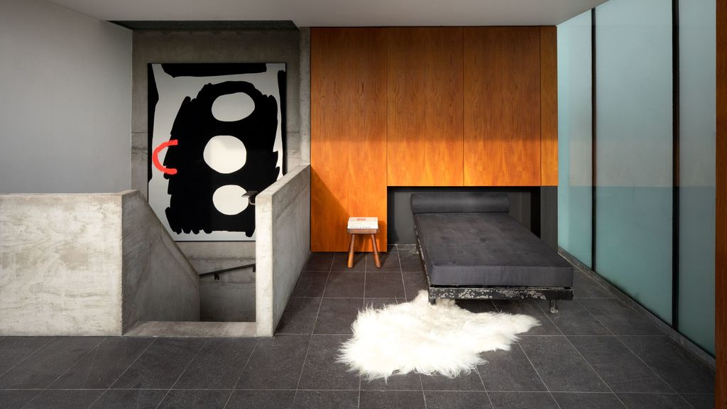 A Cornelia Baltes painting marks the entrance to the rooftop level where Chong goes to read and bask in the city views...