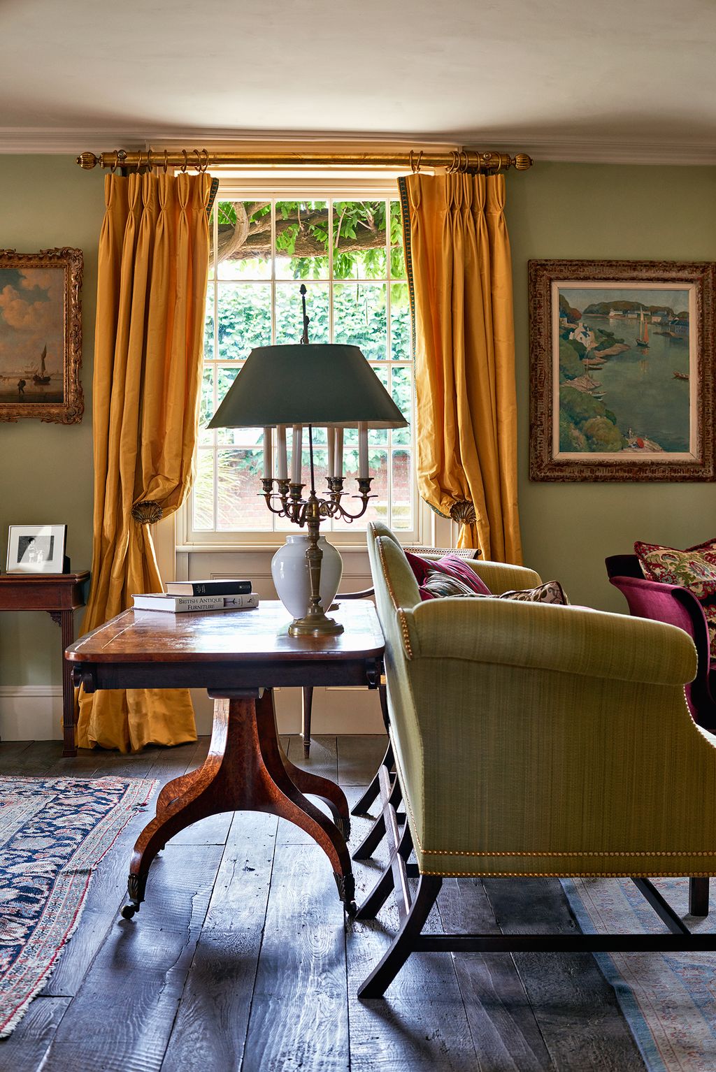 Image may contain Furniture Living Room Indoors Room Chair Home Decor Lamp Table Lamp Table and Couch