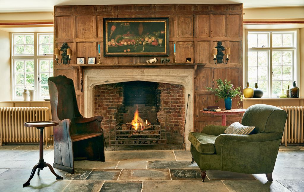 Image may contain Fireplace Indoors Hearth Furniture Interior Design Living Room and Room