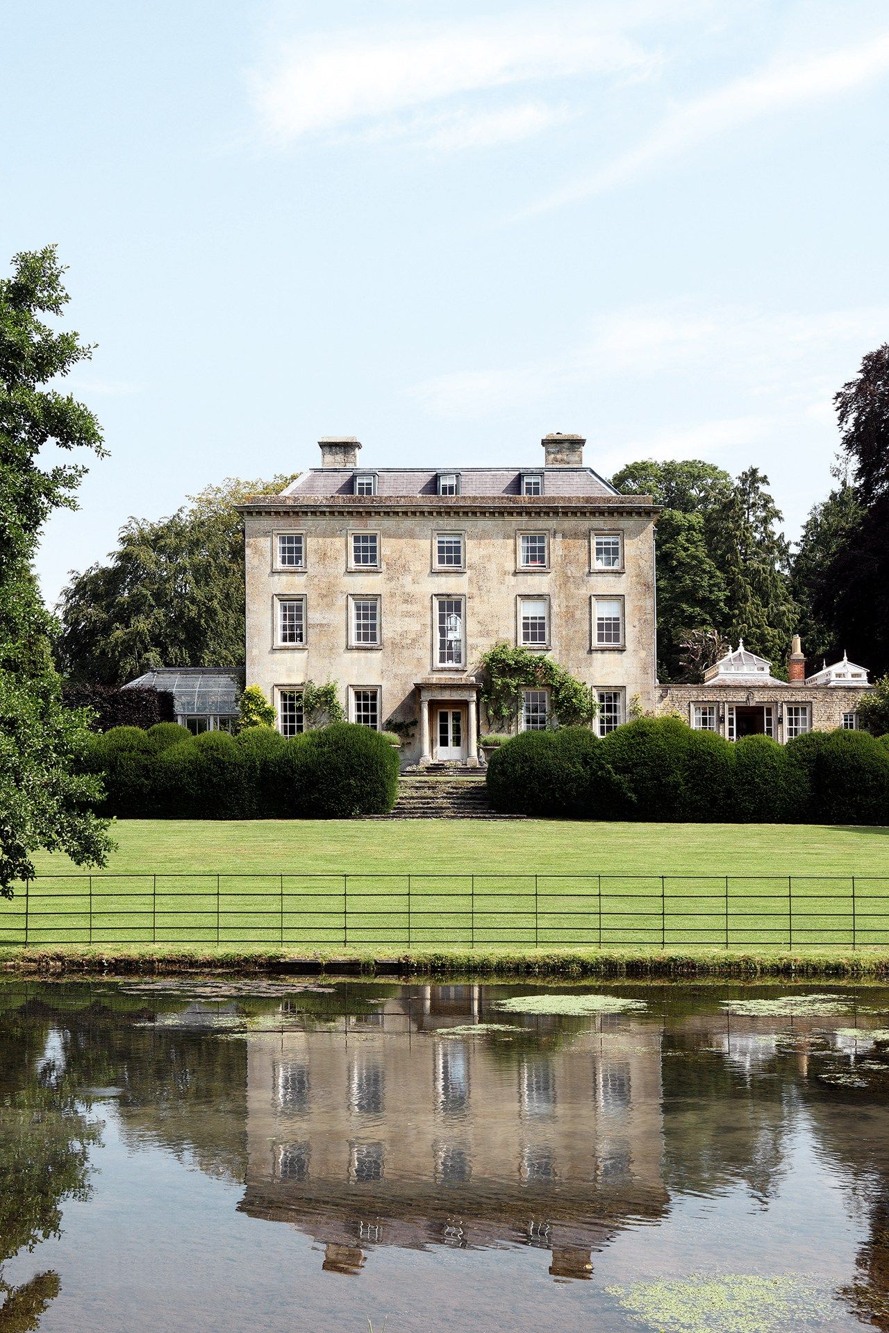 Image may contain Plant Grass Lawn Building Housing and Water