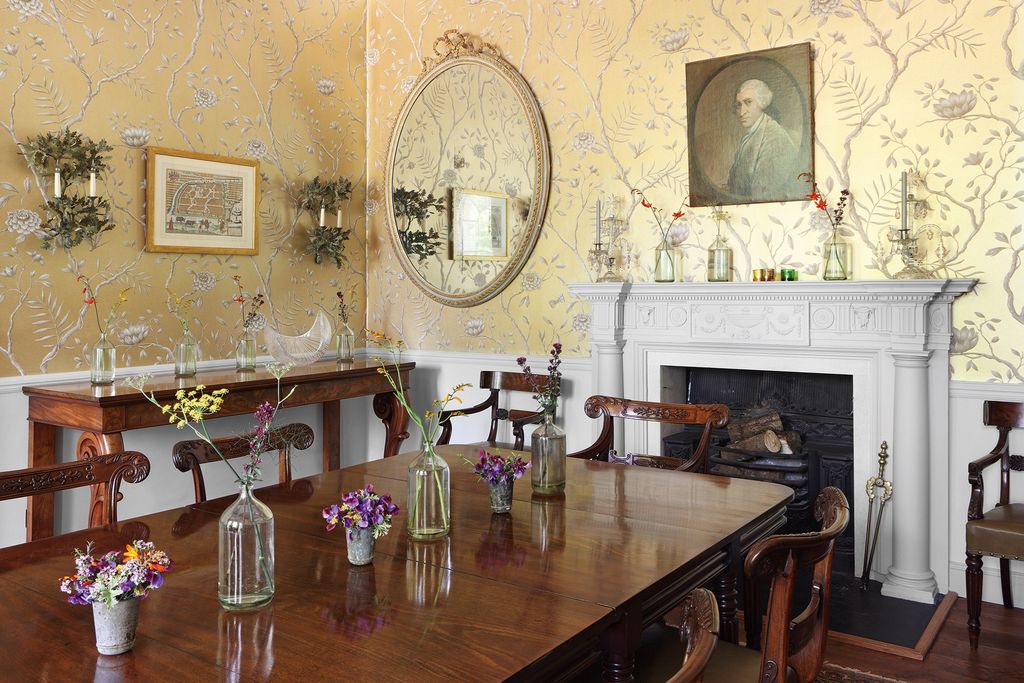 Image may contain Wood Hardwood Furniture Indoors Room Human Person Flooring Living Room Dining Room and Table