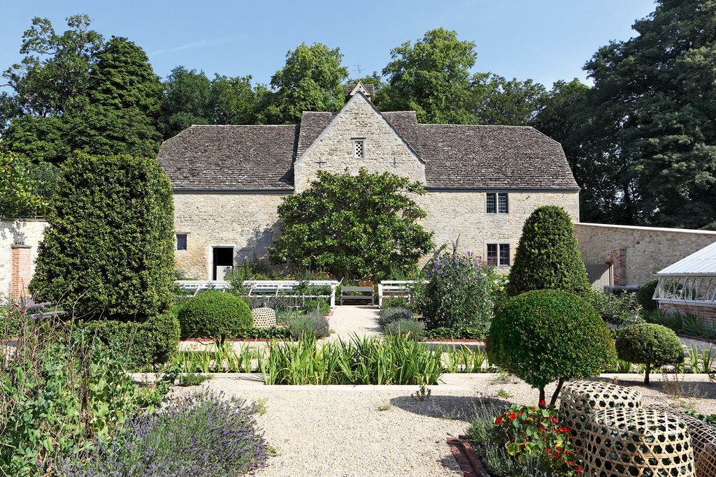 Image may contain Outdoors Garden Arbour Plant Roof and Flagstone