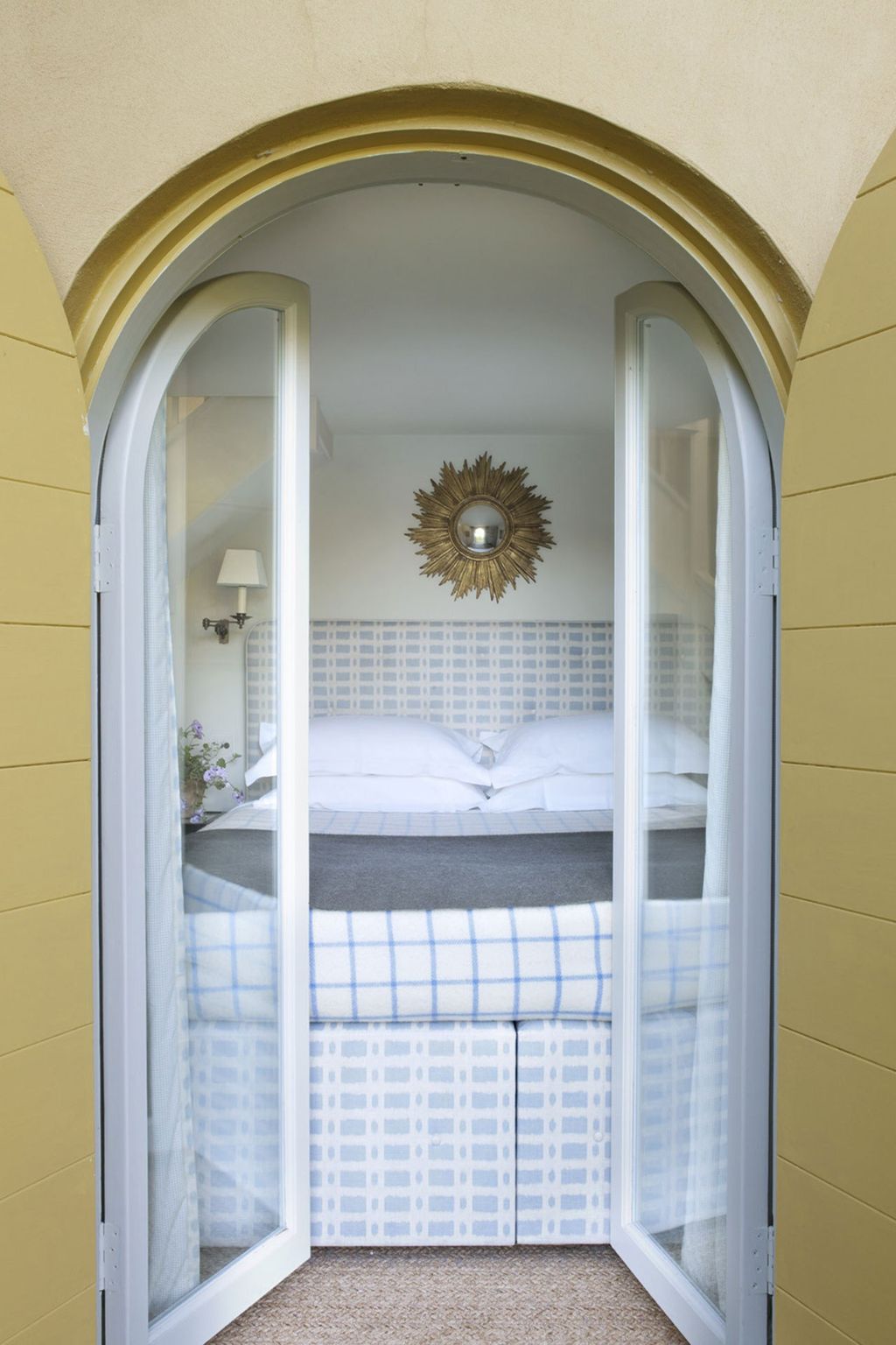 Veere's bedroom whose doors open down the canal manages to feel cosy rather than constricted despite only having room...