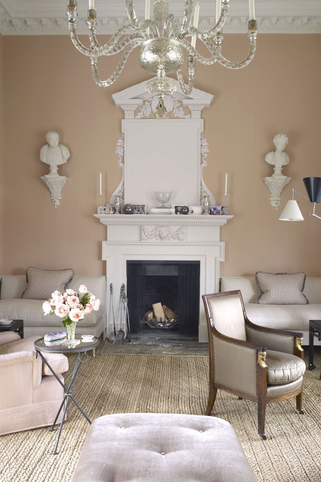 Image may contain Furniture Indoors Living Room Room Fireplace Interior Design Hearth Table and Rug