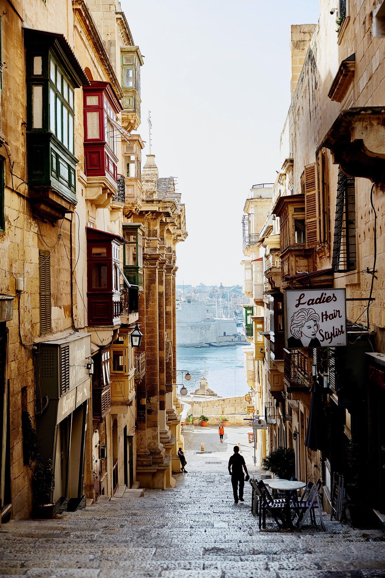 Image may contain Human Person Path Walkway Pedestrian Home Decor City Urban Road Town Street and Building