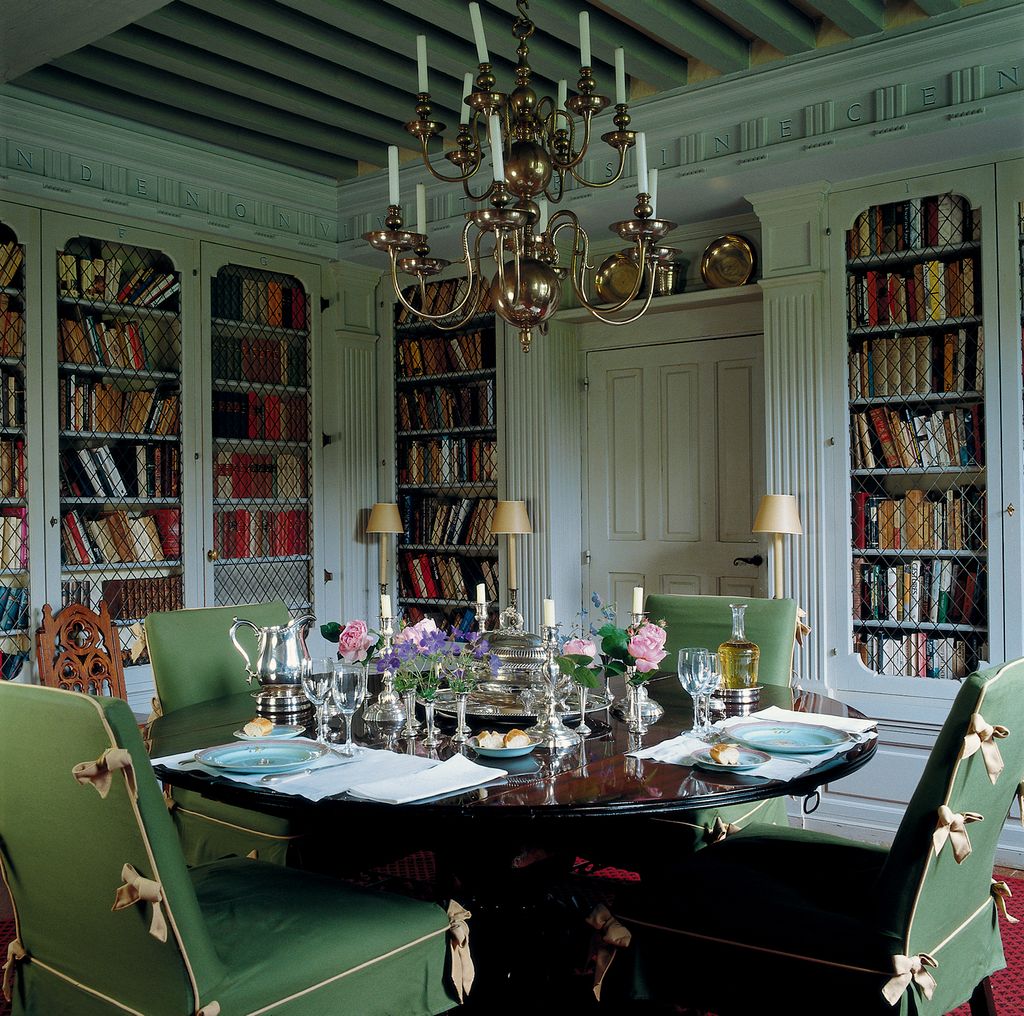 The dining roomcumlibrary inspired by the Codrington Library at All Souls College Oxford is painted a gentle grey known...
