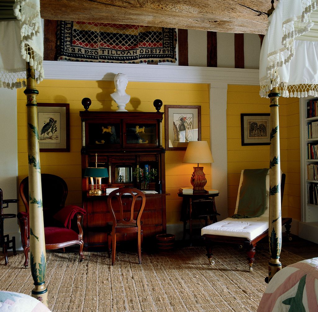 Image may contain Living Room Room Indoors Flooring Furniture Couch Interior Design Floor Wood Hardwood and Shelf