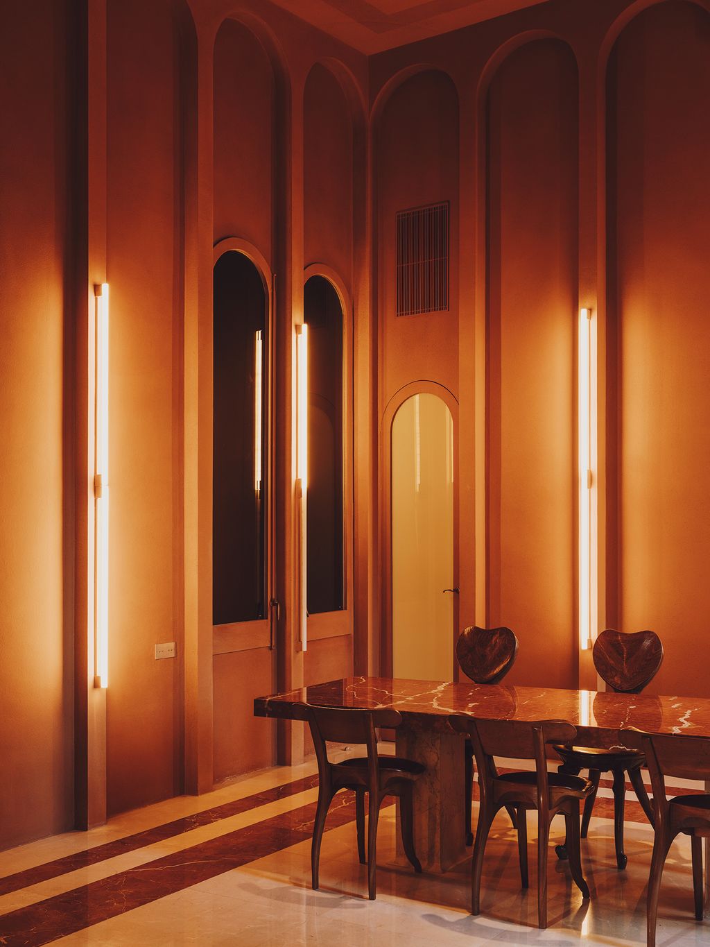 Image may contain Furniture Chair Wood Flooring Hardwood Floor Room Indoors Dining Room Dining Table and Table