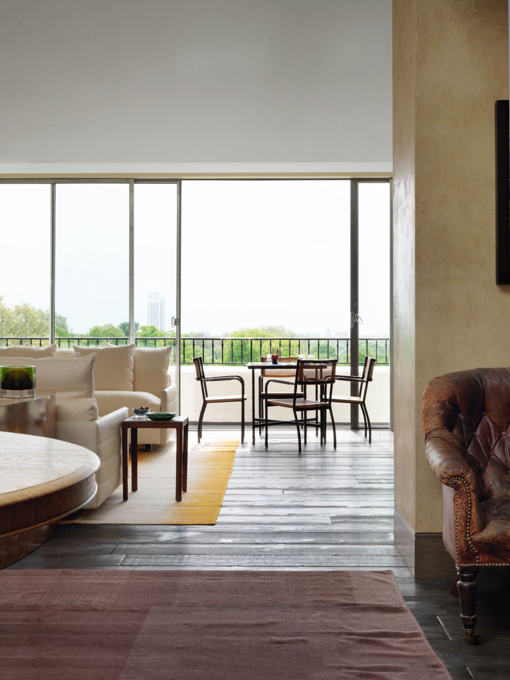 Image may contain Furniture Table Chair Tabletop Interior Design Indoors Coffee Table Lobby Room and Rug