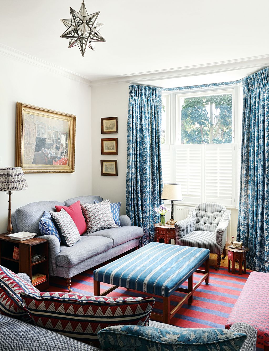 Image may contain Furniture Couch Living Room Room Indoors Rug Interior Design and Home Decor
