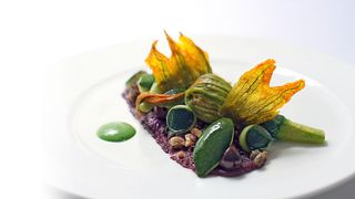 Image may contain Plant Animal Seafood Food Sea Life Lobster Dish Meal Vegetable Produce Leaf and Confectionery