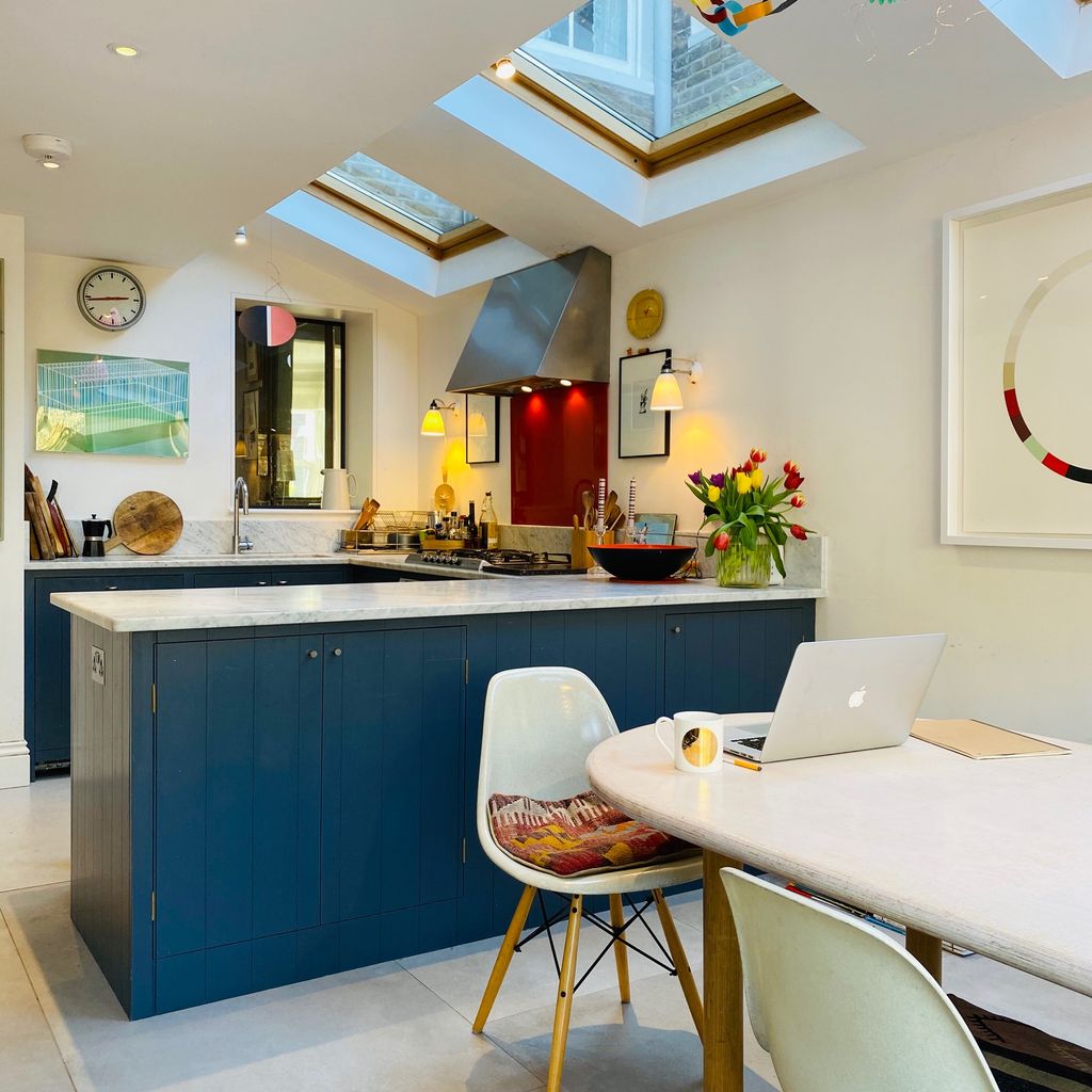 Image may contain Interior Design Indoors Architecture Building Furniture Chair Window Kitchen Island and Room