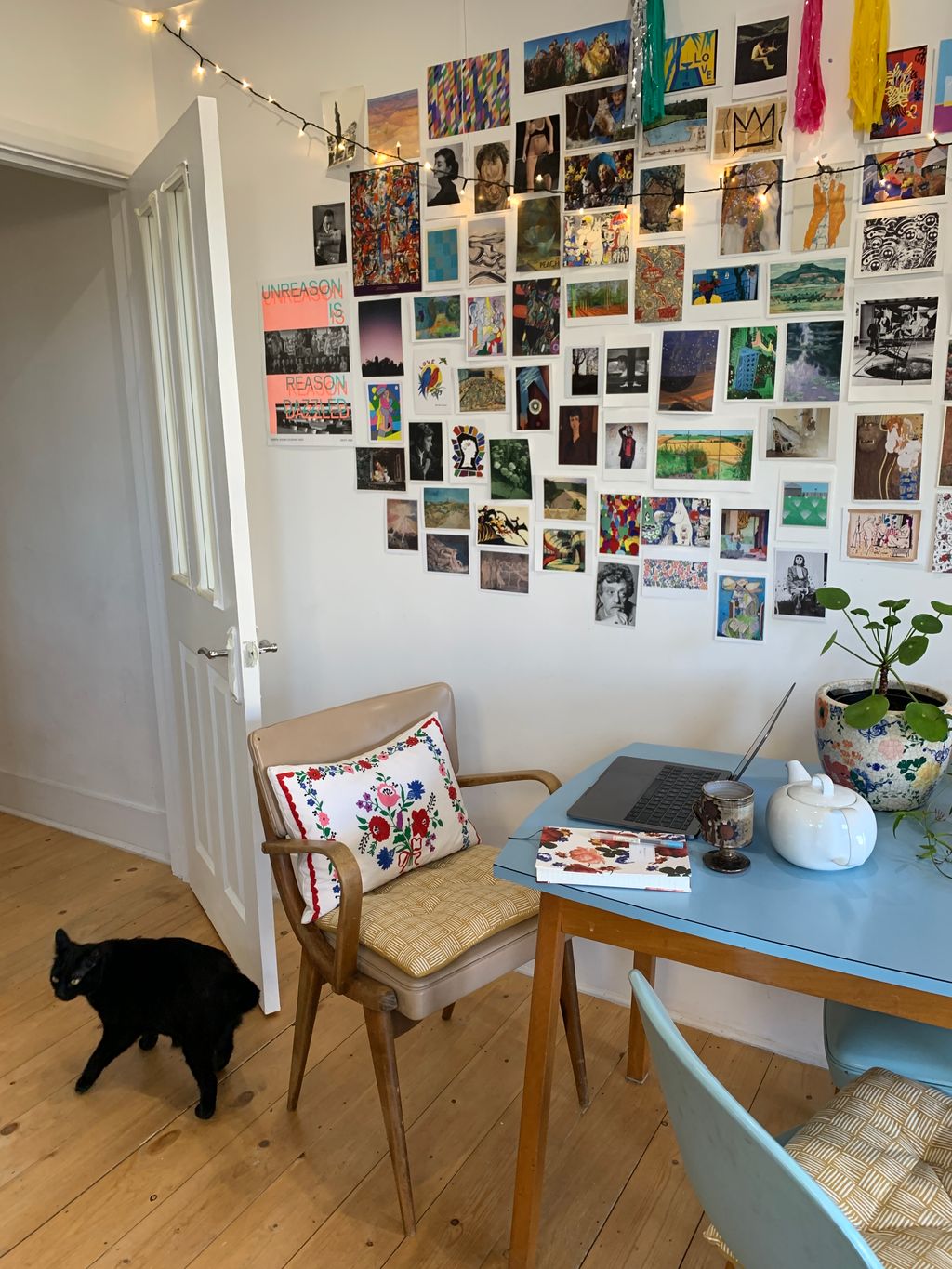 Image may contain Furniture Chair Living Room Room Indoors Table Shelf Animal Dog Mammal Pet and Canine